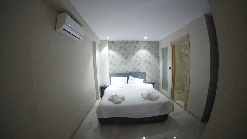 Imagen de la habitación del Le Luxe suites hotel and SPA. Foto 10