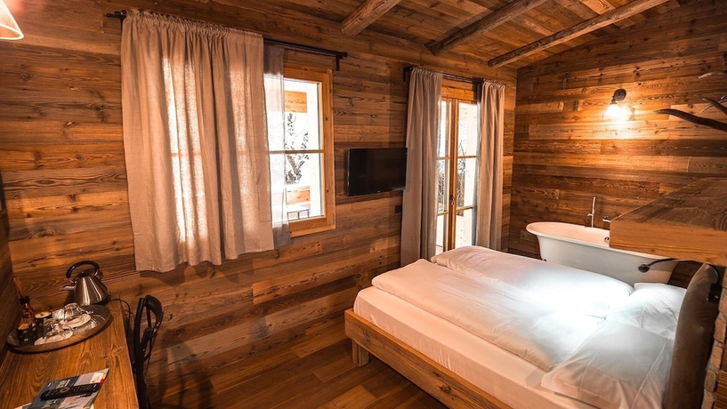 Imagen de la habitación del Ledro Mountain Chalet. Foto 7
