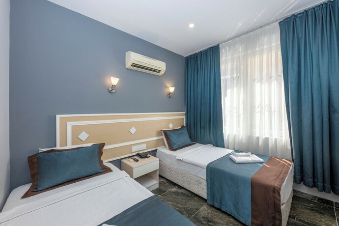 Imagen de la habitación del Legend Tulip Hotel. Foto 14