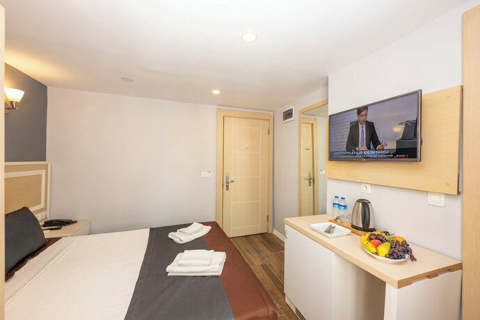 Imagen de la habitación del Legend Tulip Hotel. Foto 15