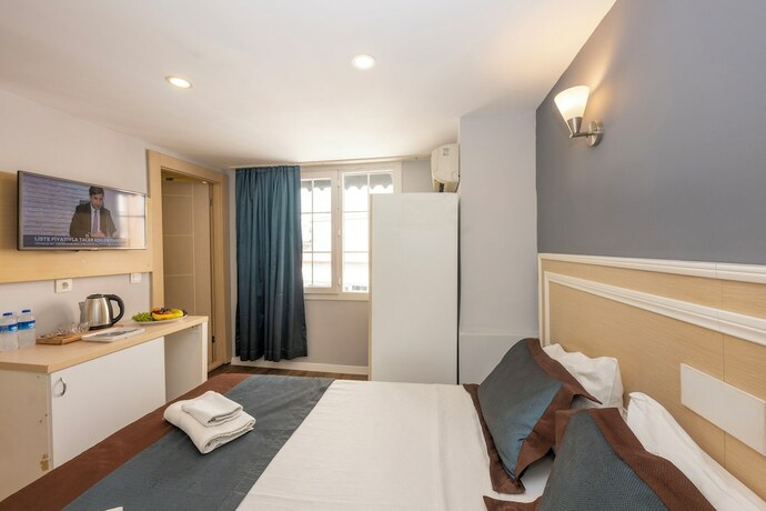 Imagen de la habitación del Legend Tulip Hotel. Foto 17