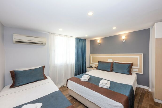 Imagen de la habitación del Legend Tulip Hotel. Foto 18