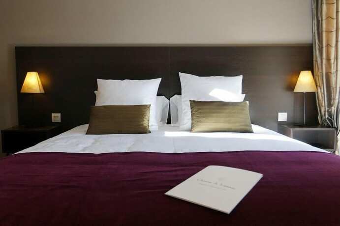 Imagen de la habitación del Les Villas du Château de Lastours. Foto 17