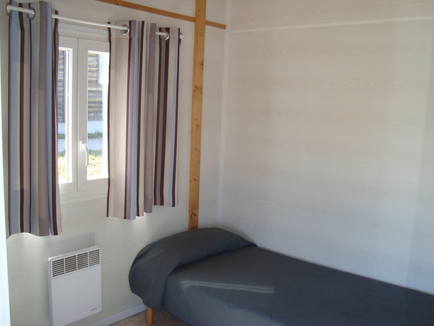 Imagen de la habitación del Les chalets de Millau. Foto 7
