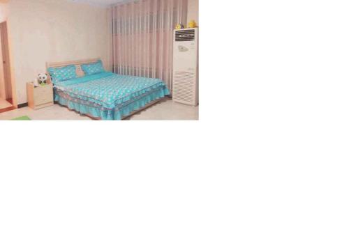Imagen de la habitación del Lijin Mingyuan Short Term Apartment. Foto 1