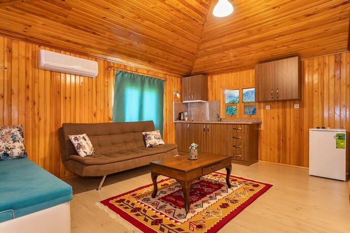 Imagen de la habitación del Likya Yanartas Bungalows. Foto 17