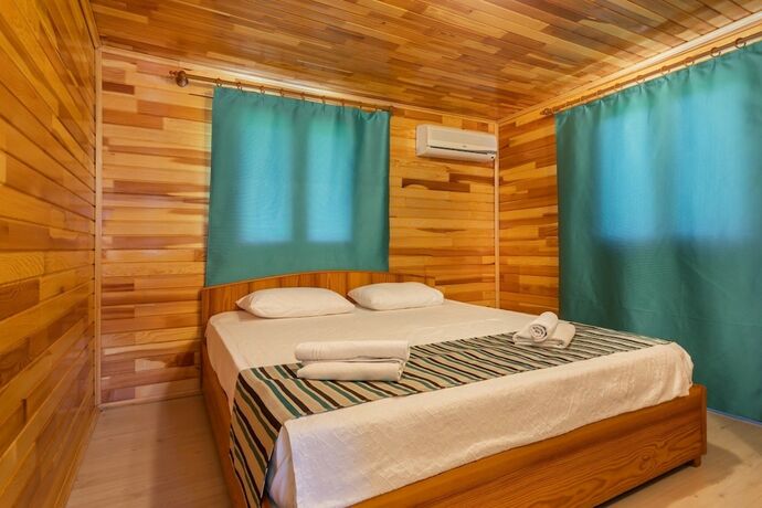 Imagen de la habitación del Likya Yanartas Bungalows. Foto 18