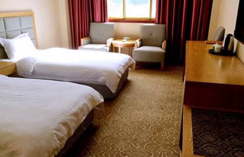 Imagen de la habitación del Linzhi Yonghui Business Hotel. Foto 1