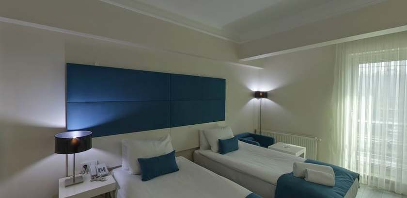 Imagen de la habitación del Lion City Hotel. Foto 10