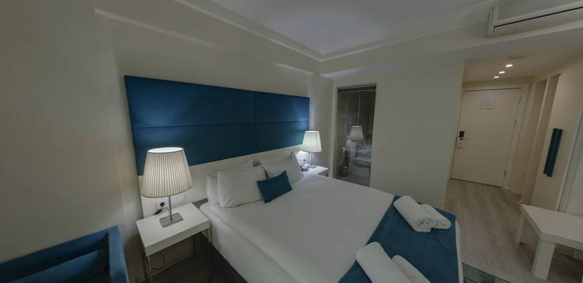 Imagen de la habitación del Lion City Hotel. Foto 13