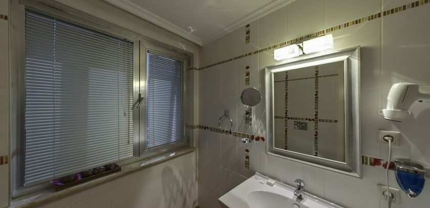 Imagen de la habitación del Lion City Hotel. Foto 14