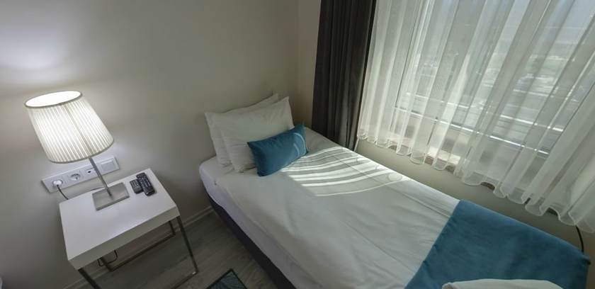 Imagen de la habitación del Lion City Hotel. Foto 16