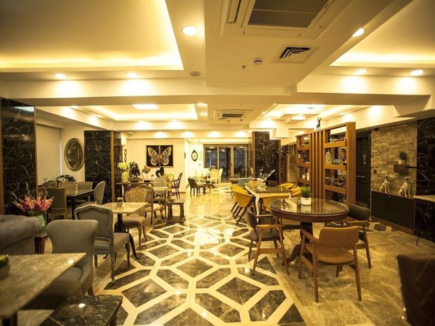Imagen del bar/restaurante del Lion Park Suites and Residence Hotel. Foto 5