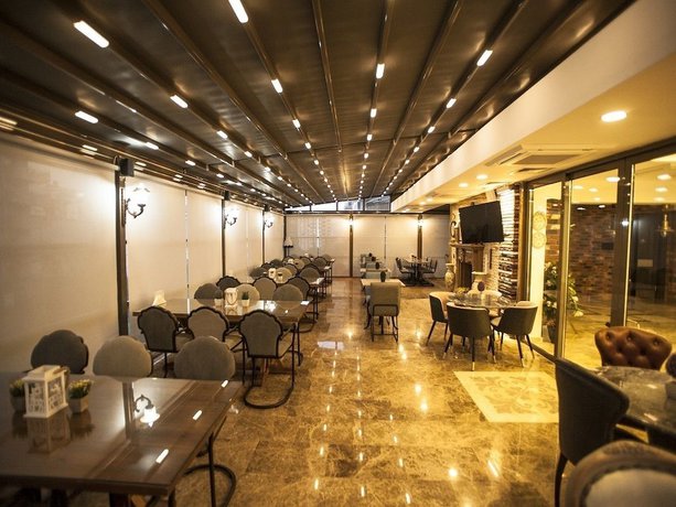 Imagen del bar/restaurante del Lion Park Suites and Residence Hotel. Foto 6