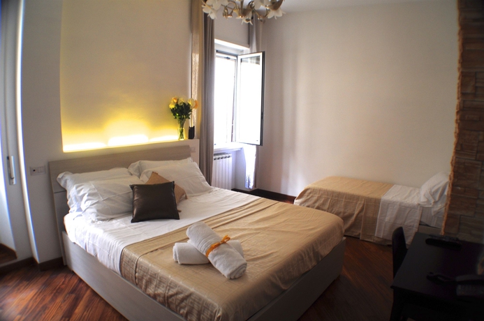 Imagen de la habitación del Little Rhome Suites. Foto 5