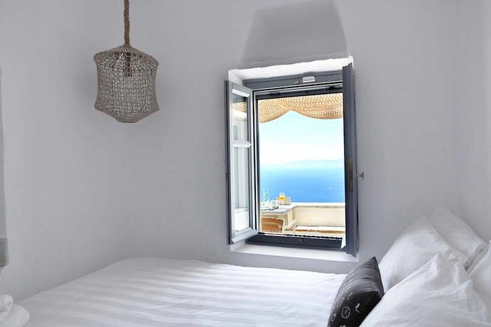 Imagen de la habitación del Living Theros Luxury Suites. Foto 8