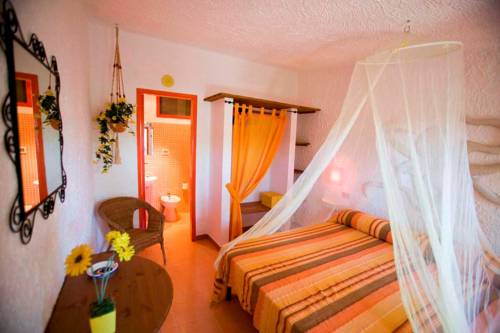 Imagen de la habitación del L'oasi Villaggio Albergo. Foto 6