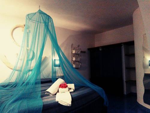 Imagen de la habitación del L'oasi Villaggio Albergo. Foto 11