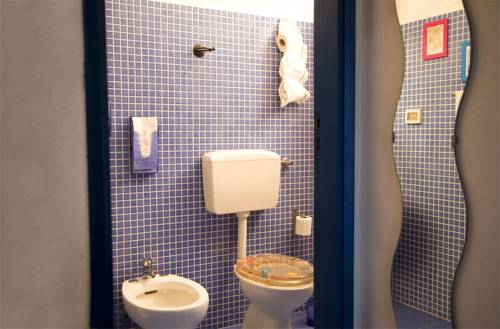 Imagen de la habitación del L'oasi Villaggio Albergo. Foto 17