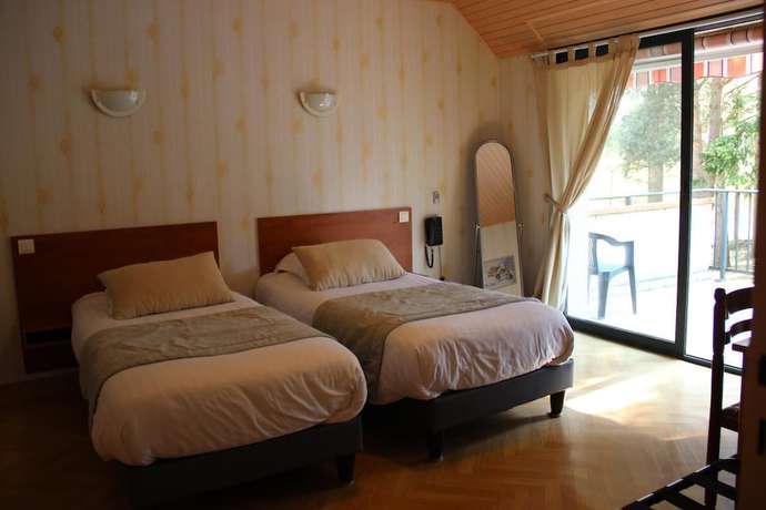 Imagen de la habitación del Logis Hôtel la Méridienne. Foto 9