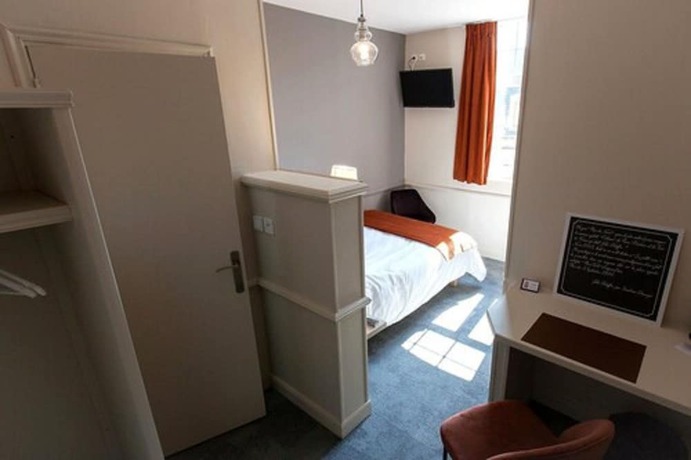 Imagen de la habitación del Logis Hostellerie Du Marche. Foto 4