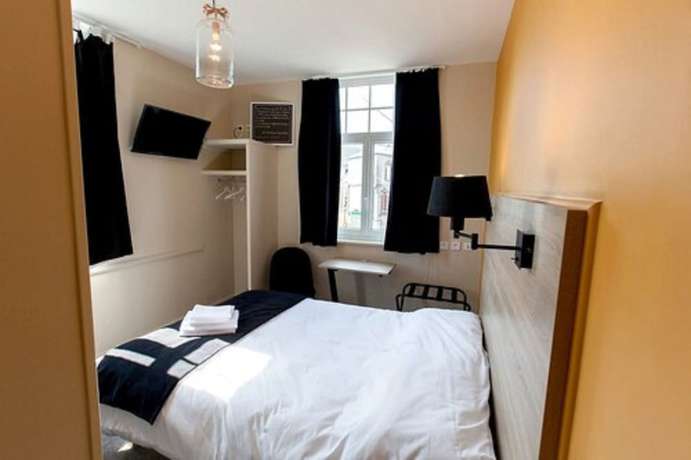 Imagen de la habitación del Logis Hostellerie Du Marche. Foto 5