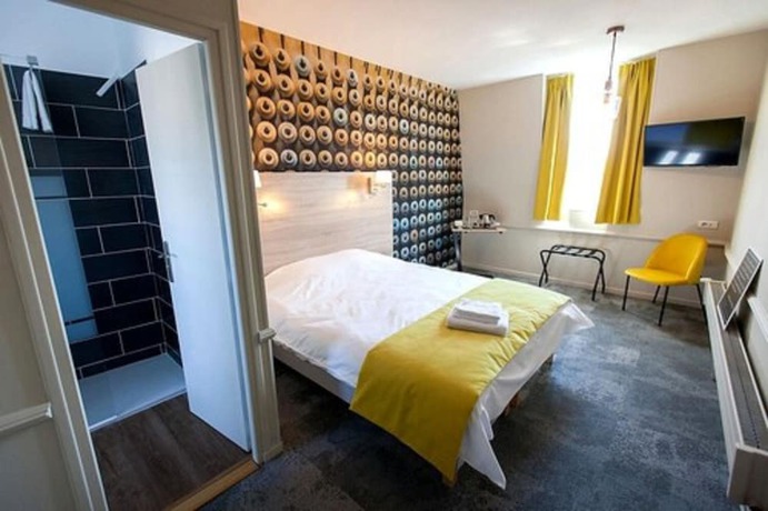 Imagen de la habitación del Logis Hostellerie Du Marche. Foto 7