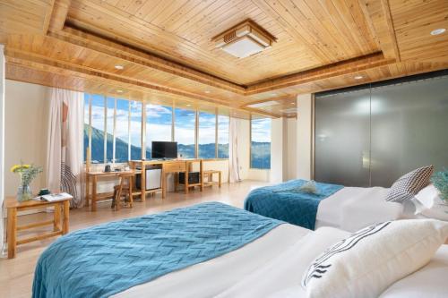 Imagen de la habitación del Longji Panorama Hotel 龙脊全景楼大酒店. Foto 11