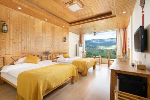 Imagen de la habitación del Longji Panorama Hotel 龙脊全景楼大酒店. Foto 12