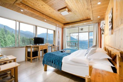 Imagen de la habitación del Longji Panorama Hotel 龙脊全景楼大酒店. Foto 14