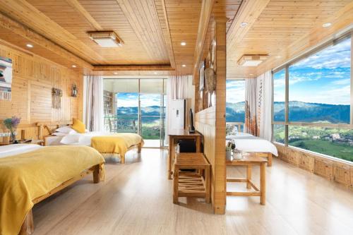 Imagen de la habitación del Longji Panorama Hotel 龙脊全景楼大酒店. Foto 16