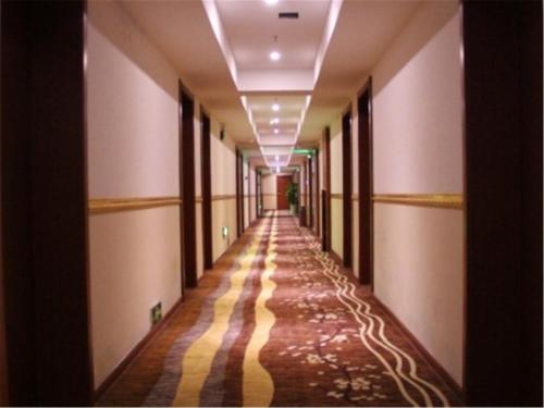 Imagen de la habitación del Longyue Hotel Huayin. Foto 7