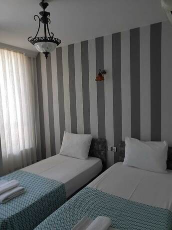 Imagen de la habitación del Lotus Otel. Foto 13