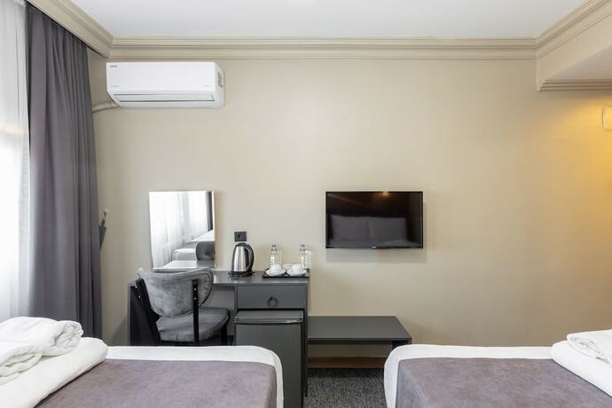 Imagen de la habitación del Loyal City Hotel. Foto 14