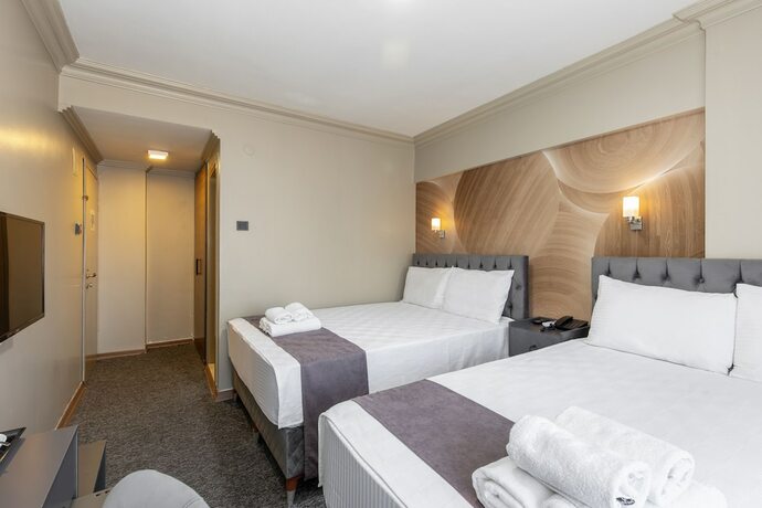 Imagen de la habitación del Loyal City Hotel. Foto 16