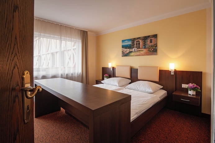 Imagen de la habitación del LuCA HOTEL. Foto 16