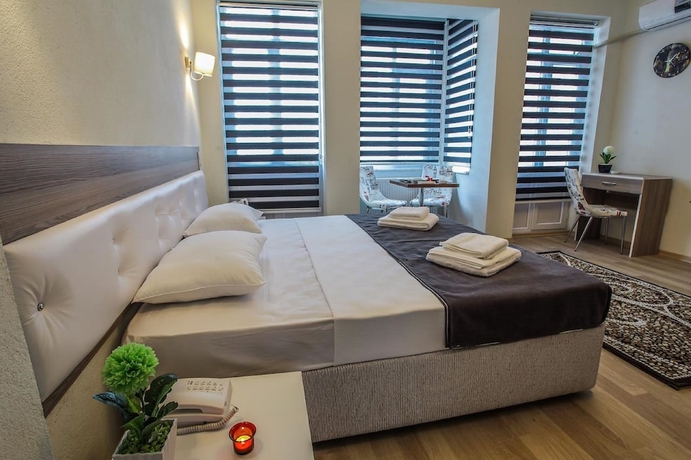 Imagen de la habitación del Luce Suite Hotel. Foto 14
