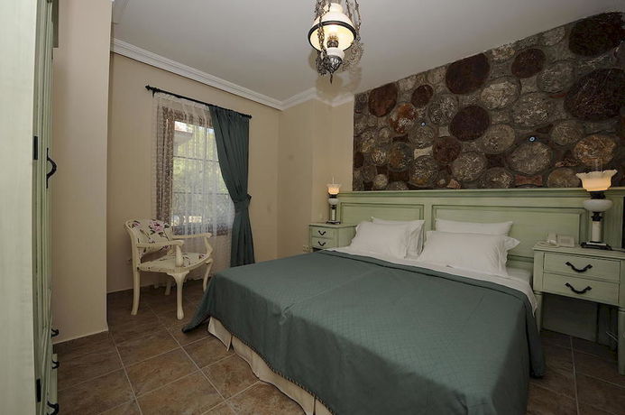 Imagen de la habitación del Lunabegonvil Tas Evler. Foto 9