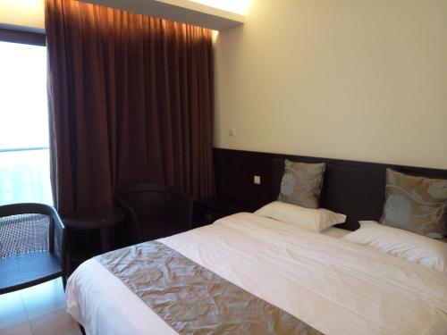 Imagen de la habitación del Lvdawu Holiday Apartment Wanning Shenzhou Peninsul. Foto 8