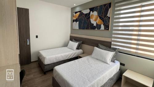 Imagen de la habitación del M A Hotel. Foto 18