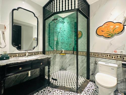 Imagen de la habitación del MAISON CAMELLIA Hotel. Foto 16