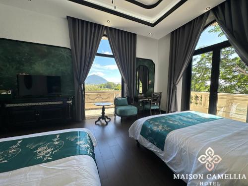 Imagen de la habitación del MAISON CAMELLIA Hotel. Foto 17