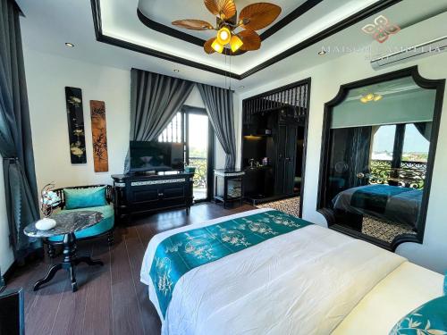 Imagen de la habitación del MAISON CAMELLIA Hotel. Foto 18