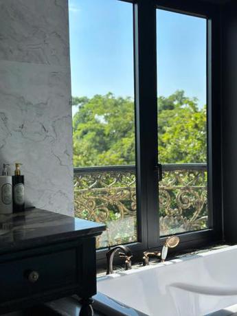 Imagen de la habitación del MAISON CAMELLIA Hotel. Foto 19