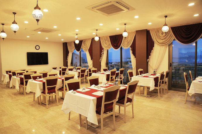 Imagen del bar/restaurante del MORDOĞAN Zeytinli Konak Butik Hotel. Foto 4