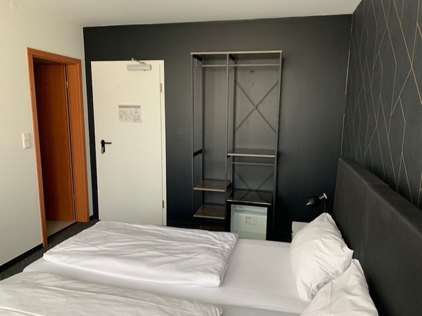 Imagen de la habitación del MOTELO Bielefeld. Foto 7