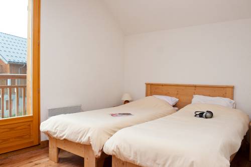 Imagen de la habitación del Madame Vacances Residence Les Chalets Du Berger. Foto 16
