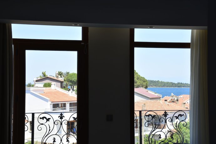 Imagen de la habitación del Maison Vourla Hotel. Foto 13
