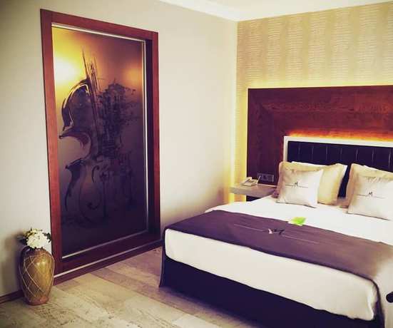 Imagen de la habitación del Maison Vourla Hotel. Foto 18