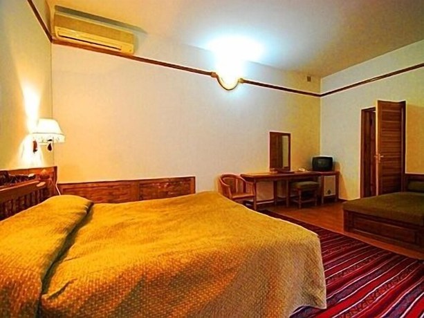 Imagen de la habitación del Malika Classic Hotel. Foto 14